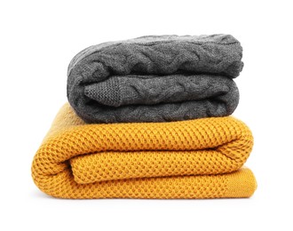 Photo of Two folded woolen blankets isolated on white