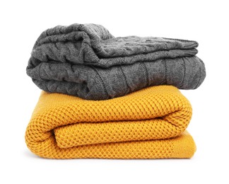 Photo of Two folded woolen blankets isolated on white