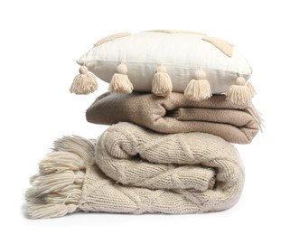 Photo of Folded woolen blankets and pillow isolated on white