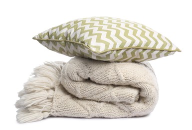 Photo of Folded woolen blanket and pillow isolated on white
