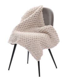 Photo of Comfortable armchair with blanket isolated on white
