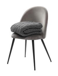 Photo of Comfortable armchair with blanket isolated on white