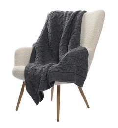 Photo of Comfortable armchair with blanket isolated on white