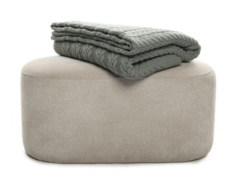 Photo of Pouf with folded blanket isolated on white