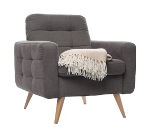Photo of Comfortable armchair with blanket isolated on white