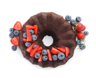 Photo of Tasty chocolate bundt cake with berries isolated on white, top view