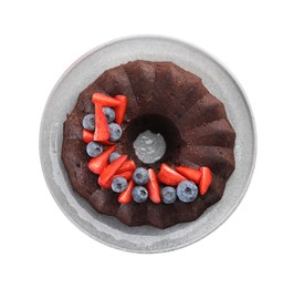 Photo of Tasty chocolate bundt cake with berries isolated on white, top view