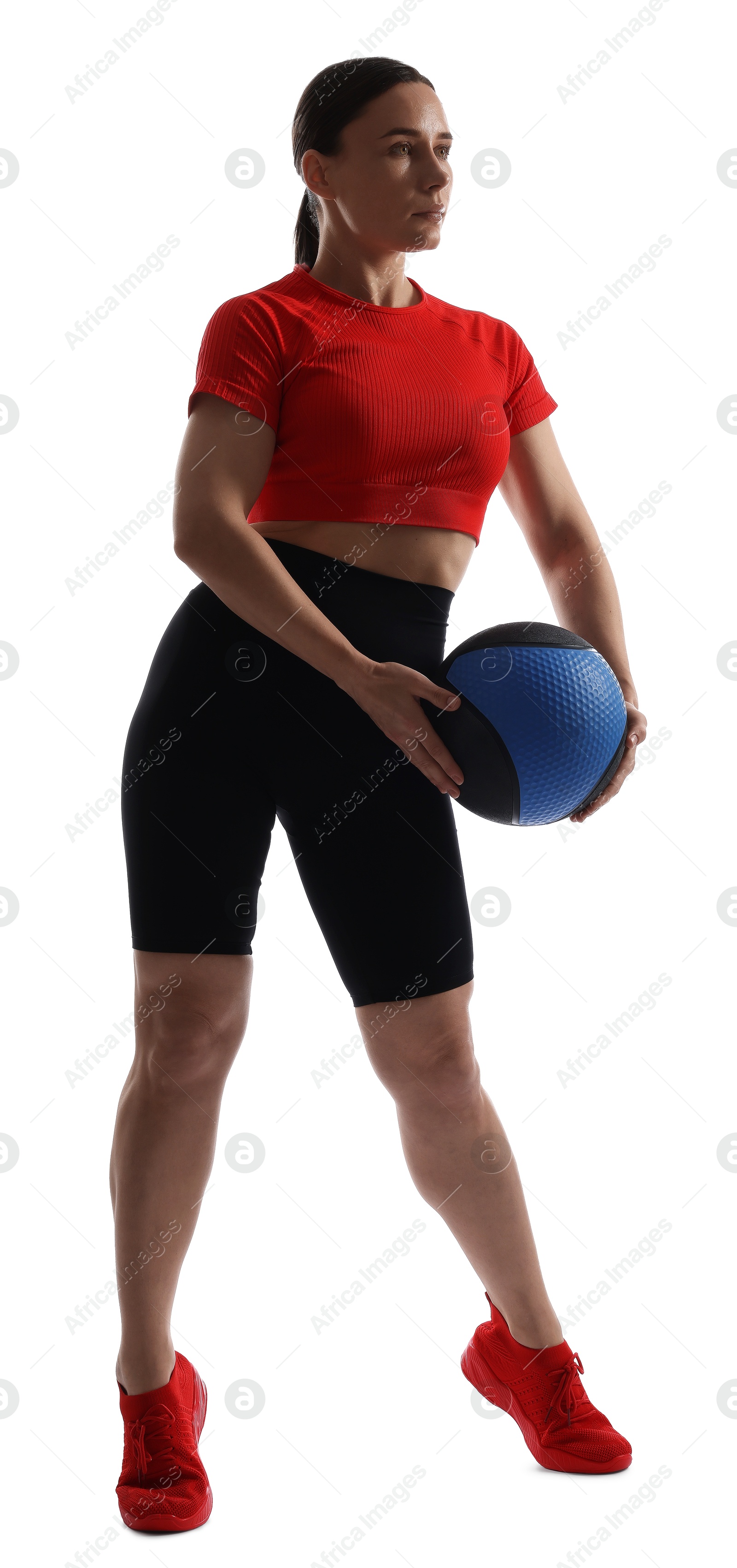 Athletic woman exercising with medicine ball on white background Photo of Athletic woman exercising with medicine ball on white background