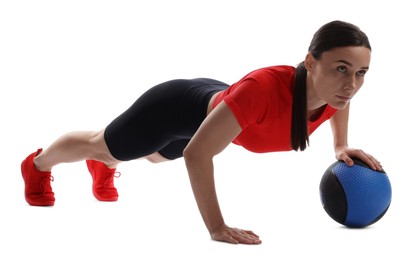 Photo of Athletic woman exercising with medicine ball on white background