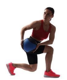 Photo of Athletic woman exercising with medicine ball on white background