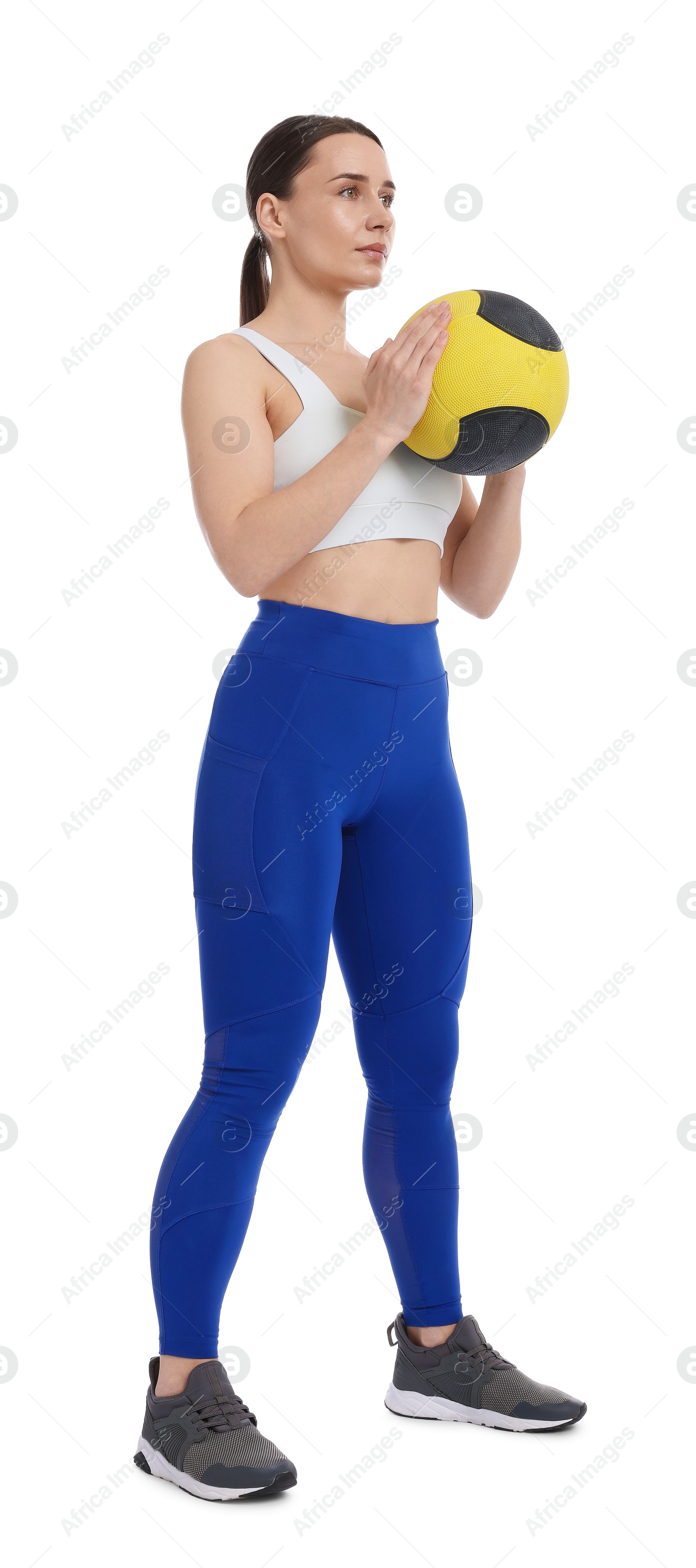 Woman with medicine ball on white background Photo of Woman with medicine ball on white background