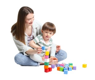 Photo of Mother and son playing with colorful cubes on white background