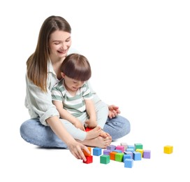 Photo of Mother and son playing with colorful cubes on white background