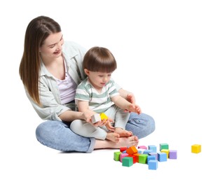 Photo of Mother and son playing with colorful cubes on white background