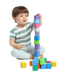 Photo of Cute little child playing with colorful cubes on white background