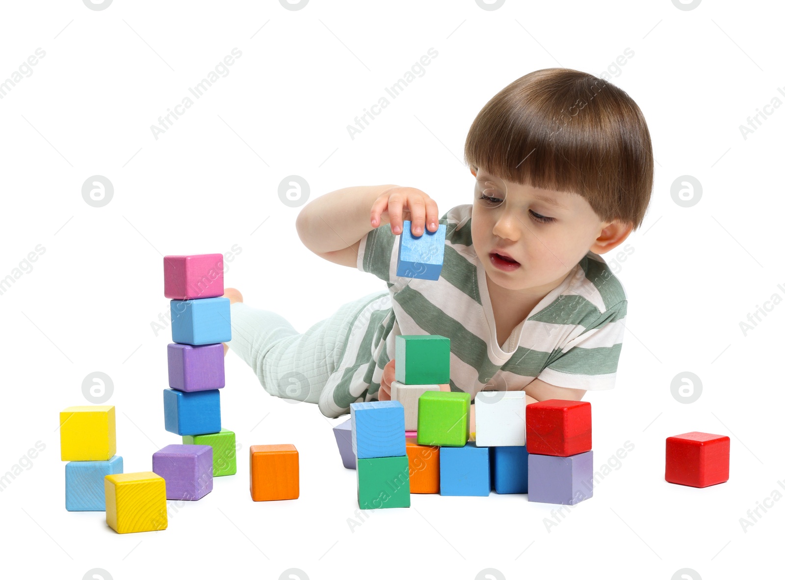 Cute little child playing with colorful cubes on white background Photo of Cute little child playing with colorful cubes on white background