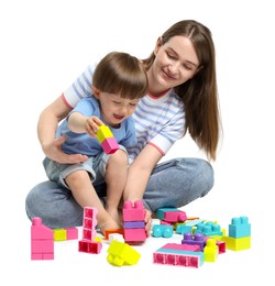 Photo of Mother and son playing with building bricks on white background