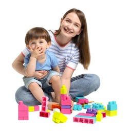 Photo of Mother and son playing with building bricks on white background