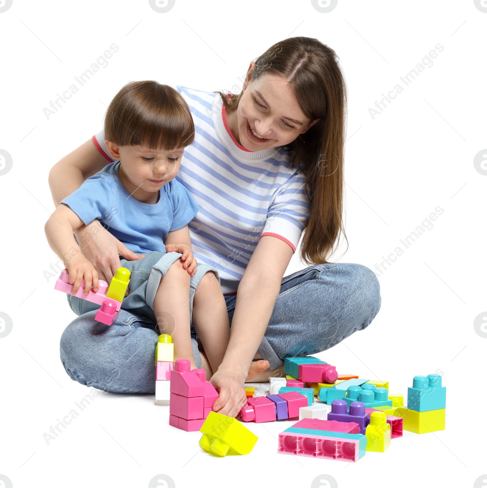 Mother and son playing with building bricks on white background Photo of Mother and son playing with building bricks on white background