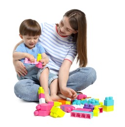 Photo of Mother and son playing with building bricks on white background