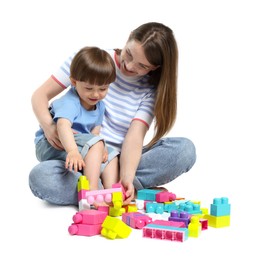 Photo of Mother and son playing with building bricks on white background