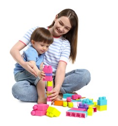 Photo of Mother and son playing with building bricks on white background