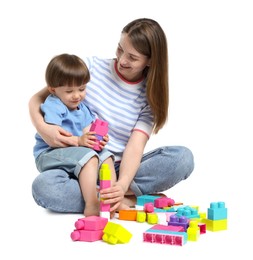 Photo of Mother and son playing with building bricks on white background