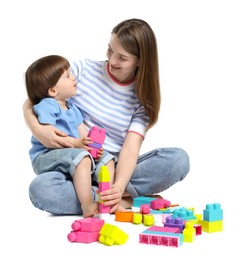 Photo of Mother and son playing with building bricks on white background