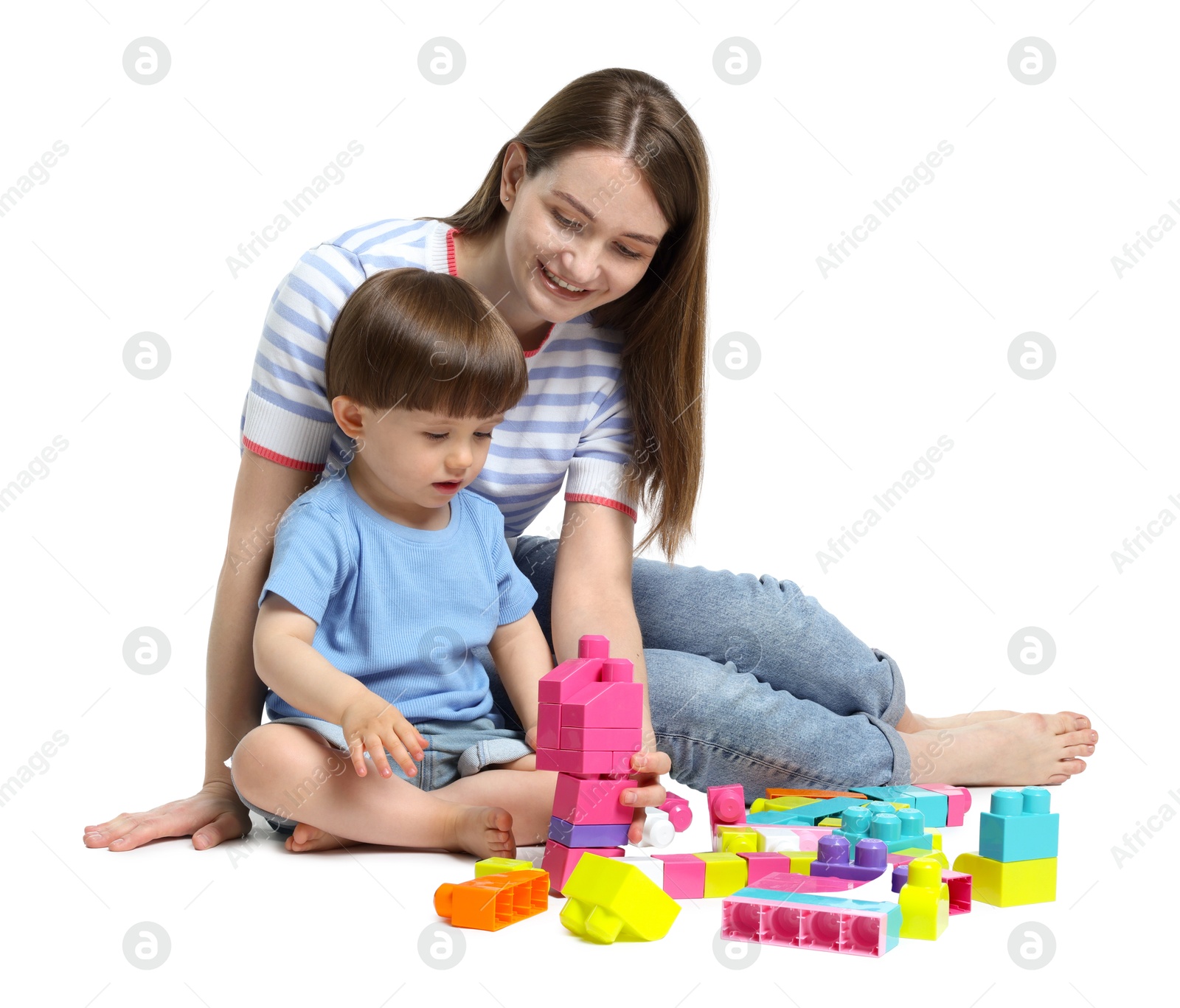 Mother and son playing with building bricks on white background Photo of Mother and son playing with building bricks on white background