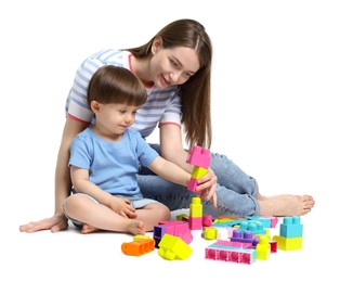 Photo of Mother and son playing with building bricks on white background