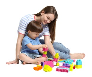 Photo of Mother and son playing with building bricks on white background