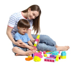 Photo of Mother and son playing with building bricks on white background