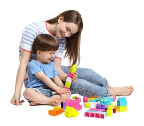 Photo of Mother and son playing with building bricks on white background
