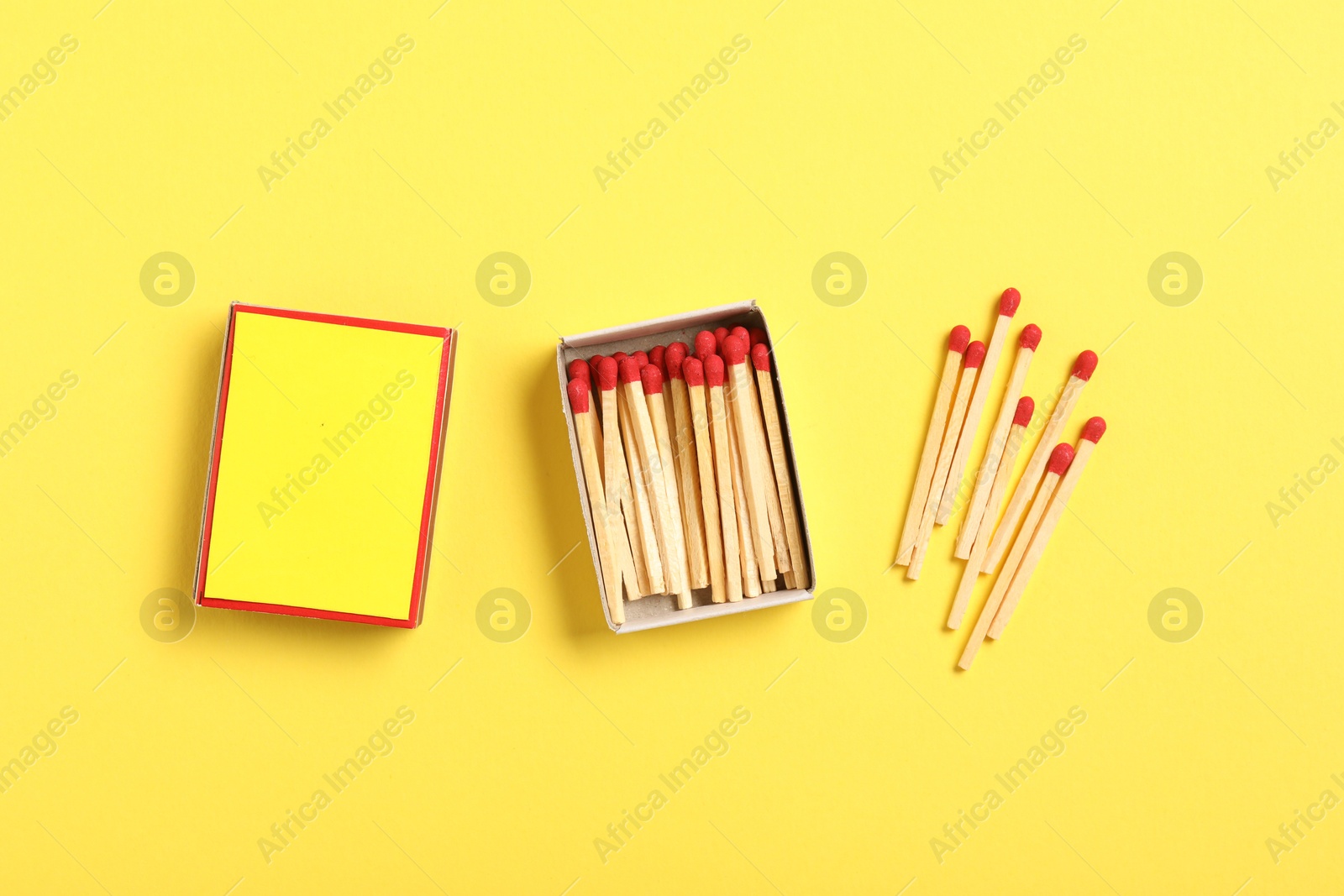 Matches and box on yellow background, flat lay. Mockup for design Photo of Matches and box on yellow background, flat lay. Mockup for design