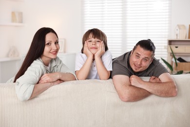 Photo of Parents with their son at home. Lovely family