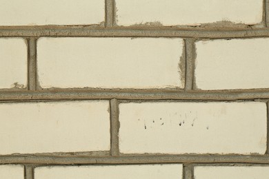 Photo of Light brick wall as background, closeup view