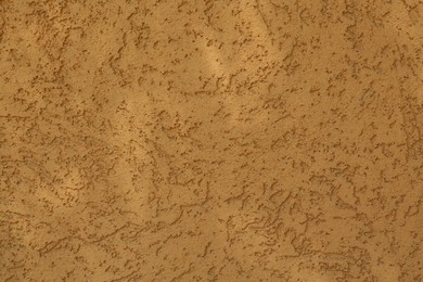 Photo of Orange textured surface as background, closeup view
