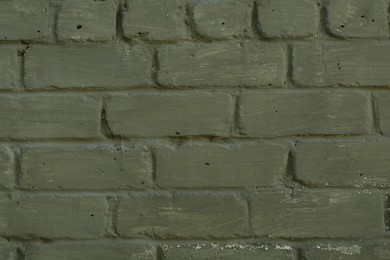 Photo of Green brick wall as background, closeup view