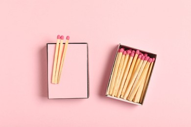 Photo of Matches and box on pink background, flat lay