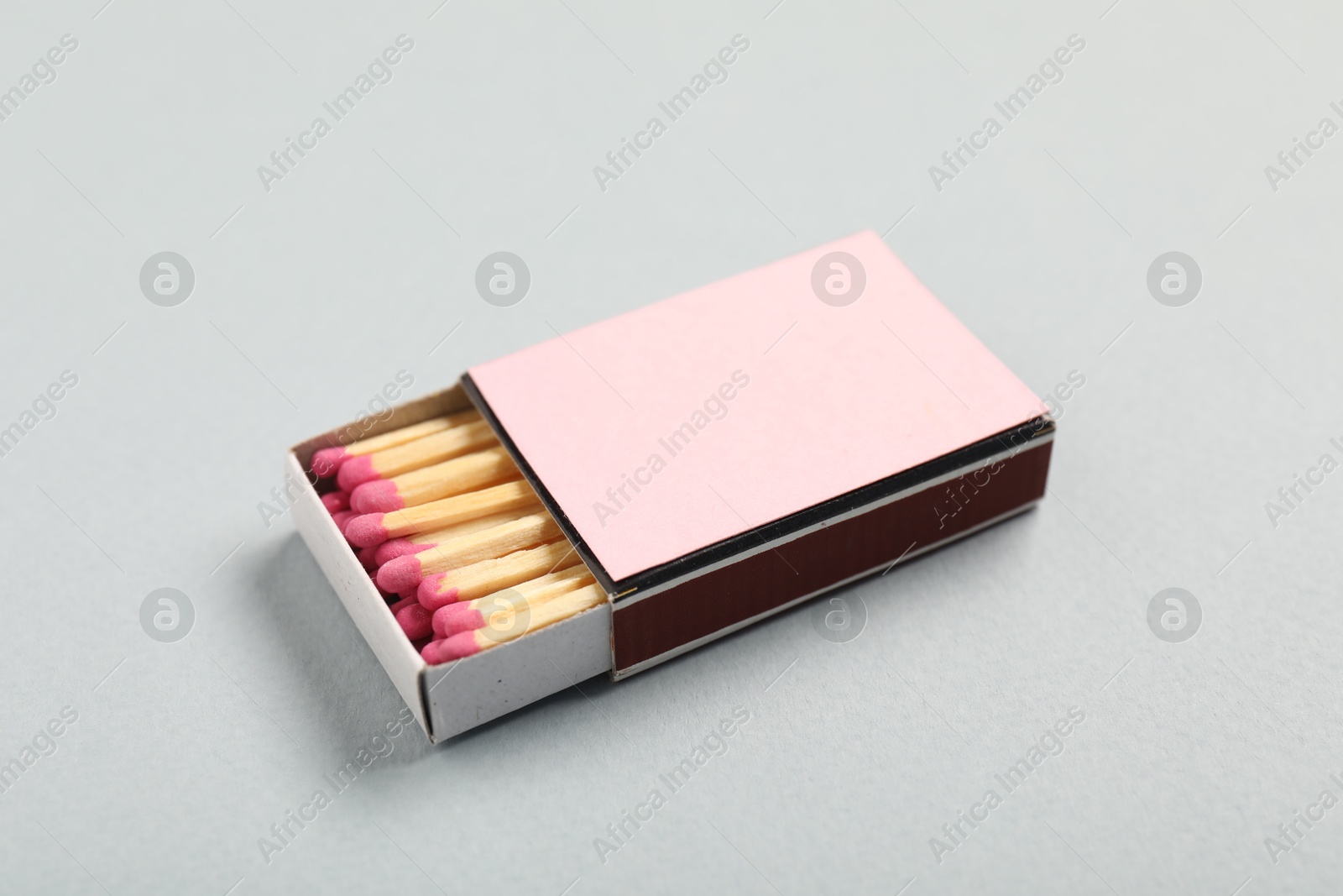 Matches in box on grey background, closeup. Mockup for design Photo of Matches in box on grey background, closeup. Mockup for design