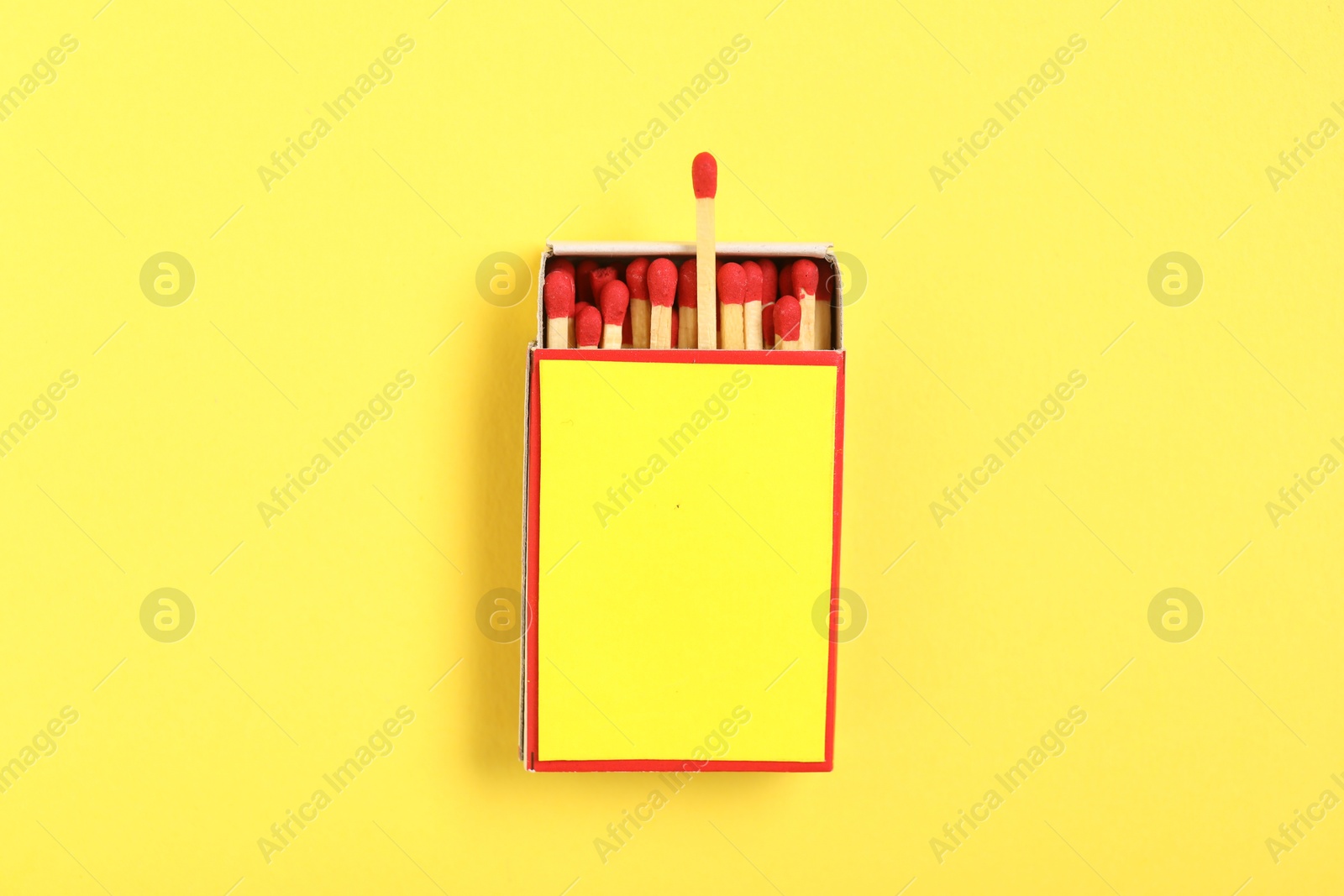 Matches in box on yellow background, top view. Mockup for design Photo of Matches in box on yellow background, top view. Mockup for design