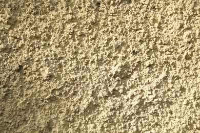 Photo of Beige cement textured surface as background, closeup