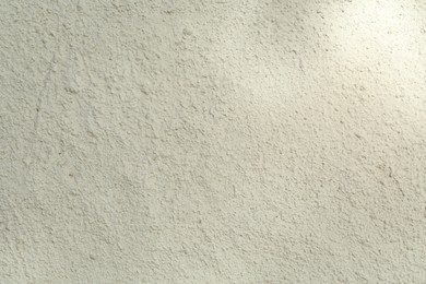 Photo of White cement textured surface as background, closeup