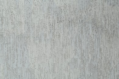 Photo of Light grey cement textured surface as background, closeup