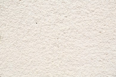 Photo of White cement textured surface as background, closeup