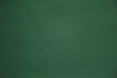 Photo of Green textured surface as background, closeup view