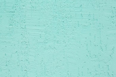 Photo of Turquoise cement textured surface as background, closeup