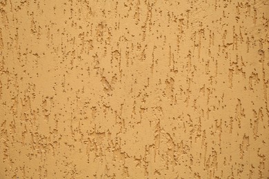Photo of Orange textured surface as background, closeup view