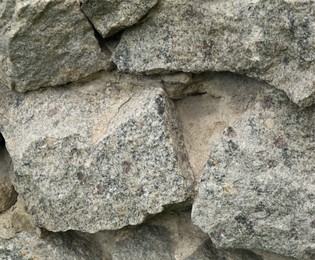 Photo of Old stone wall as background, closeup view