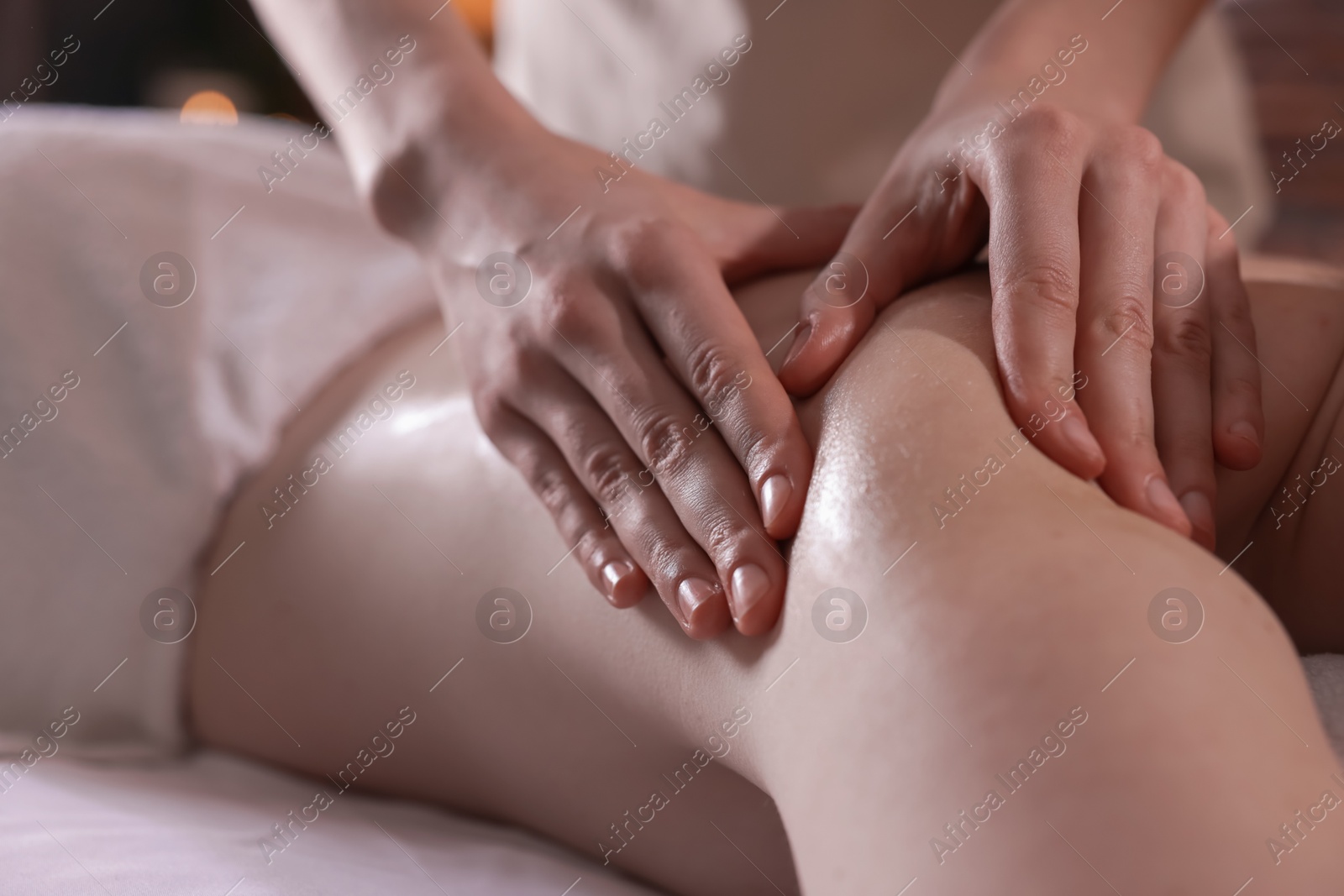 Woman receiving back massage with oil in spa salon, closeup Photo of Woman receiving back massage with oil in spa salon, closeup